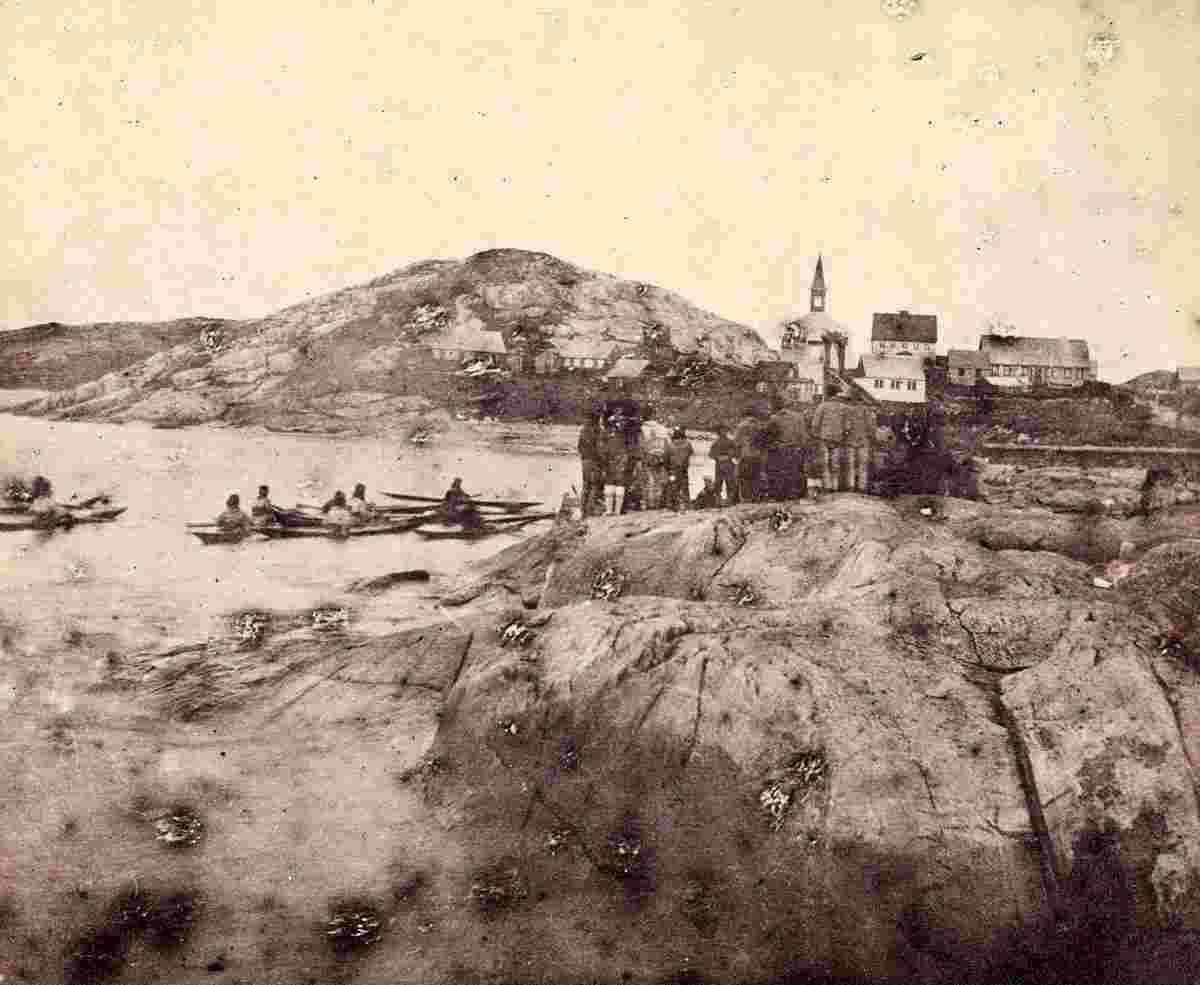 Nuuk. View toward the city including Inuits on land and in kayaks, before 1889
