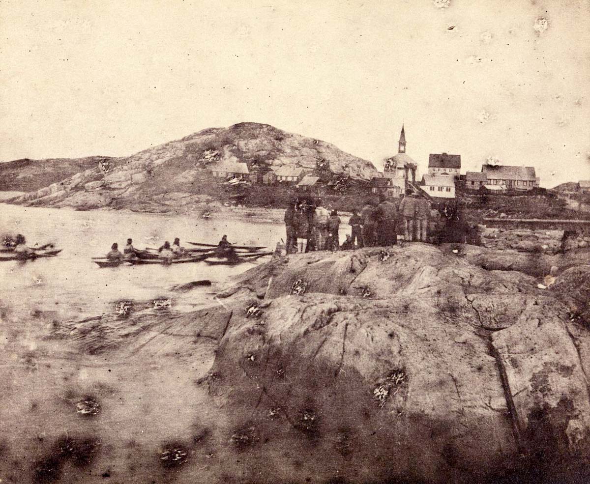 Nuuk (Godthåb, Godthaab). View toward the city including Inuits on land and in kayaks, before 1889