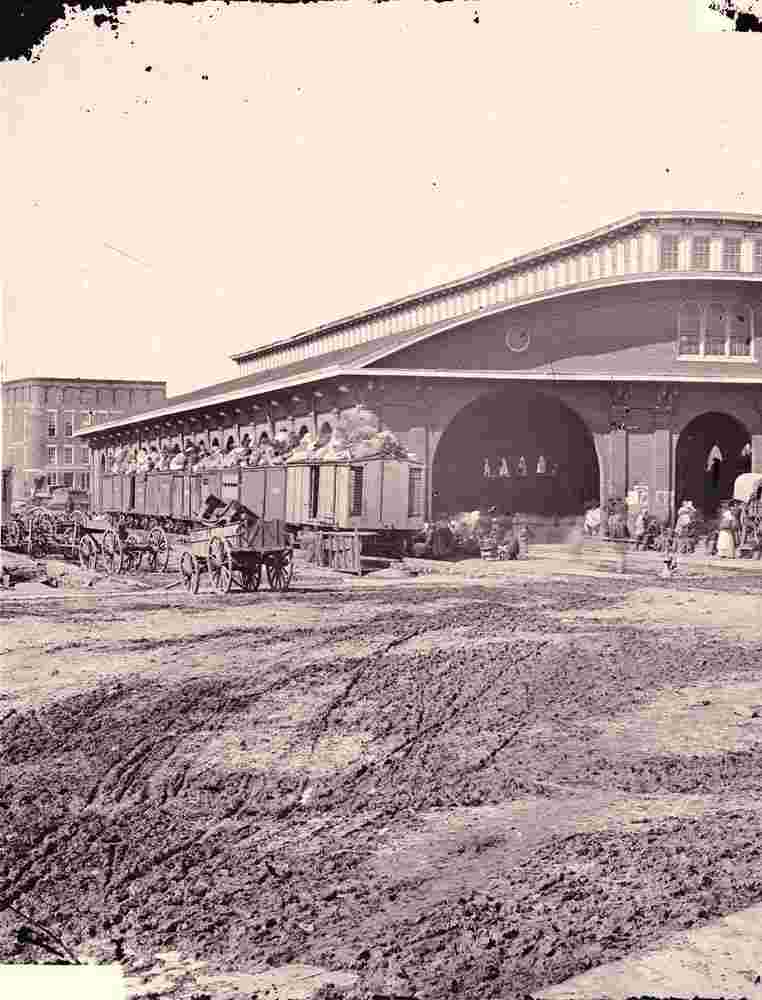 Atlanta. Boxcars with refugees at railroad depot, 1864