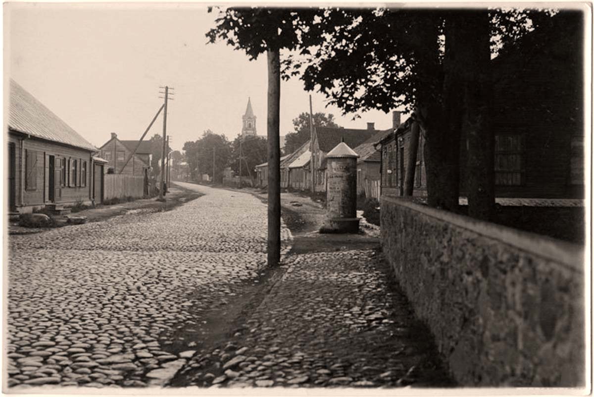 Jekabpils - Panorama of street with poster booth, 1910s