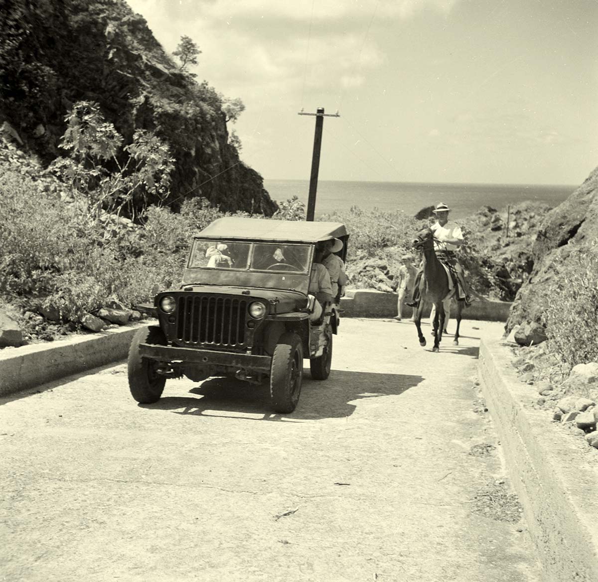 The Bottom. On the road in a jeep, 1947