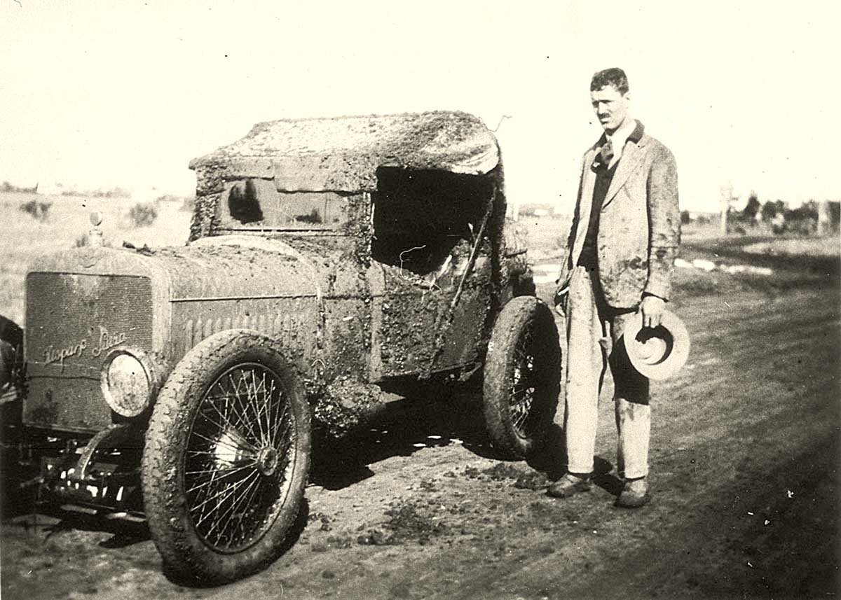 Griffith. 'Hispano Suiza' car covered in mud. 'Just outside Griffith on Sunday' (inscription)
