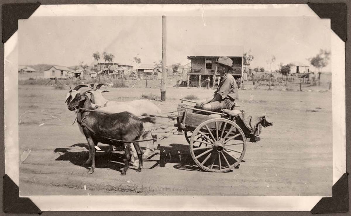 Mount Isa. Young boy with a goat cart on a Mount Isa street, 1936