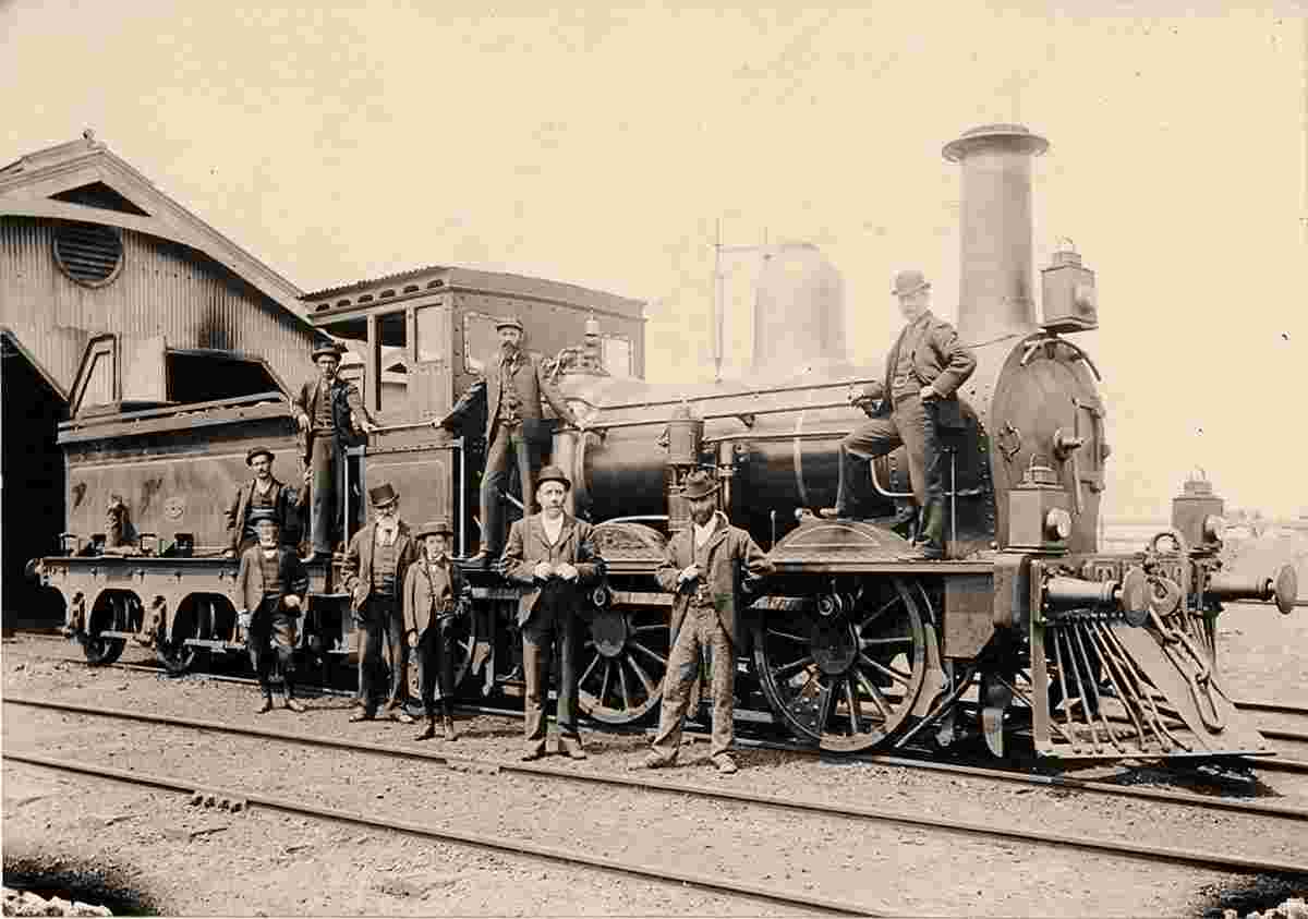 Portland. Group standing on and beside a steam locomotive, 1898