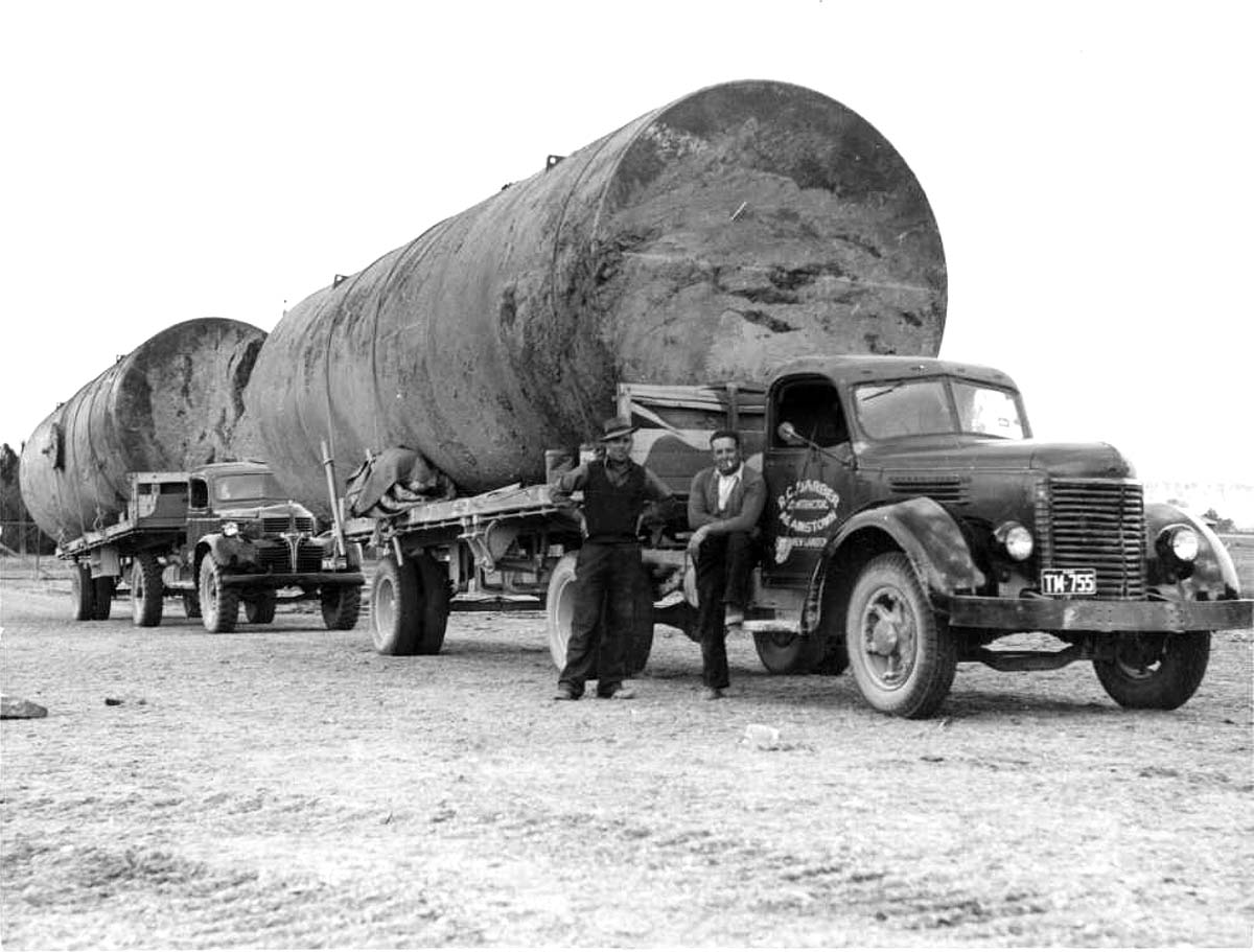 Two large tanks on two trucks