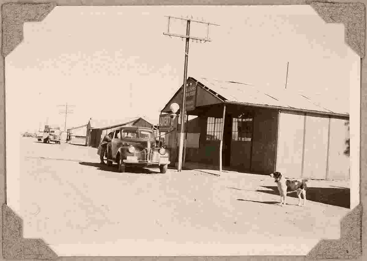 Tennant Creek. Car being refueled at Williams' general store, 1946