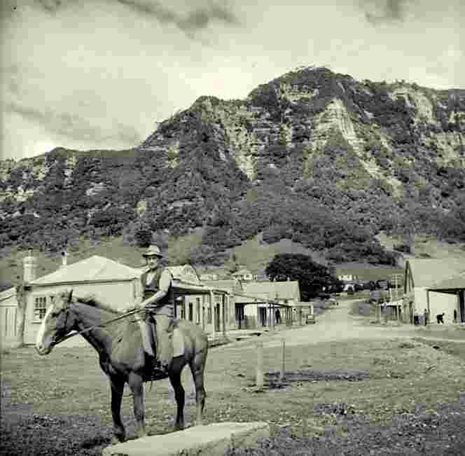 Te Araroa. Man on a horse on the Main Street, 3 October 1943