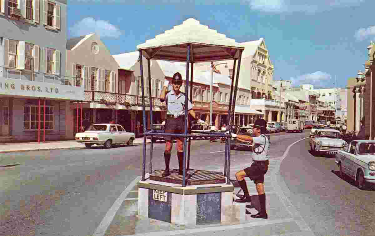 Hamilton. Policeman directs traffic from bird cage, 1959