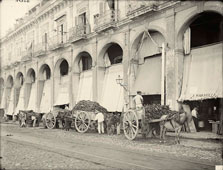 Havana. Fruit wagon unloading at market