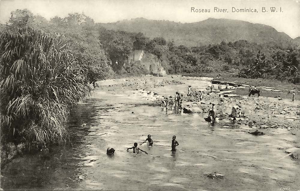 Roseau. Natives washing and bathing in Roseau River