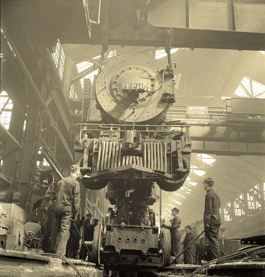 Topeka. Wheeling an engine in the Atchison, Topeka and Santa Fe Railroad locomotive shops, 1943