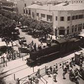 Tel Aviv. Locomotive crossing Allenby Street, near Main Post Office, 1946