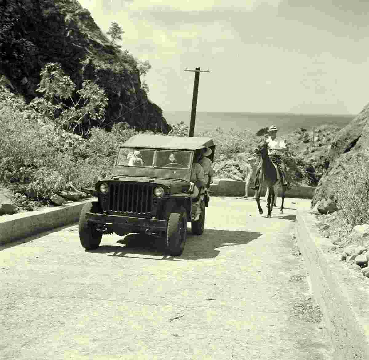 The Botton. On the road in a jeep, 1947
