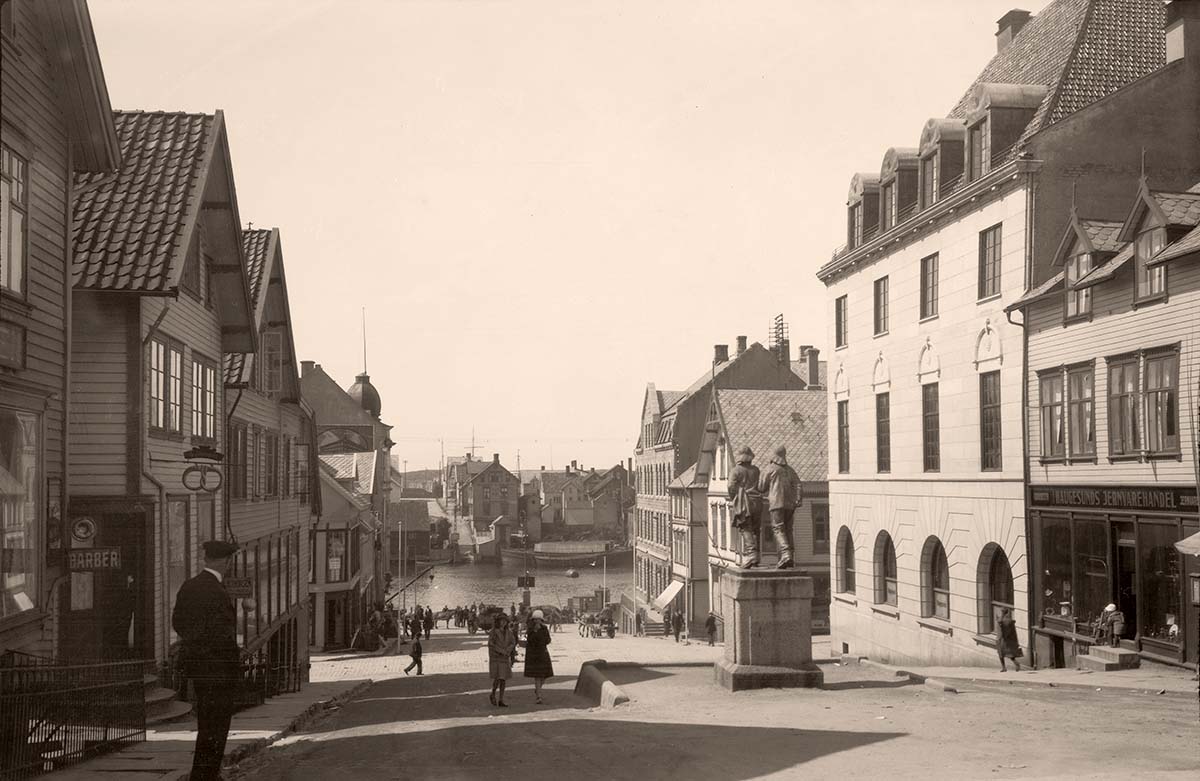 Haugesund. Panorama of city street, monument to fishermen, between 1900 and 1950