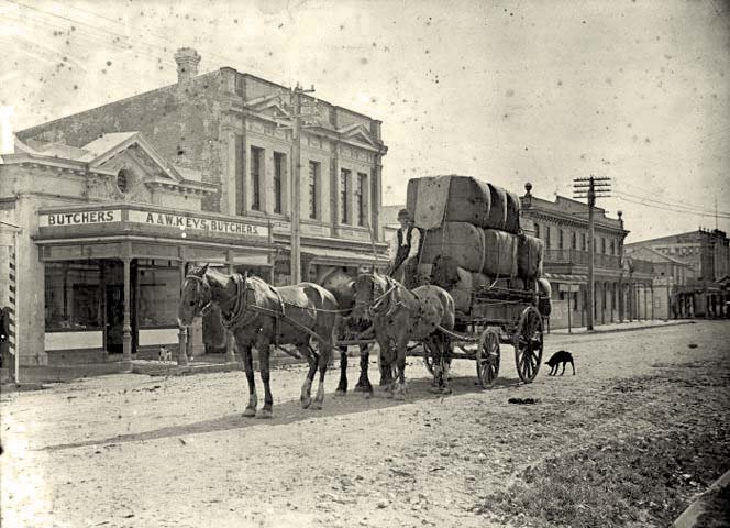 Upper Hutt. Man on a horse pulled cart, outside the butchery of A & W Keys, Main Street, 1920